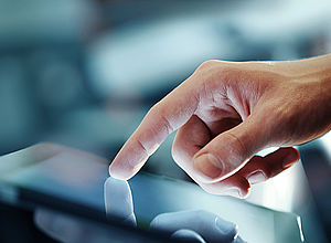 Hand with one finger tapping on a tablet | DIGINNO - a project of Interreg Baltic Sea Region (photo: Panthermedia/peshkova)