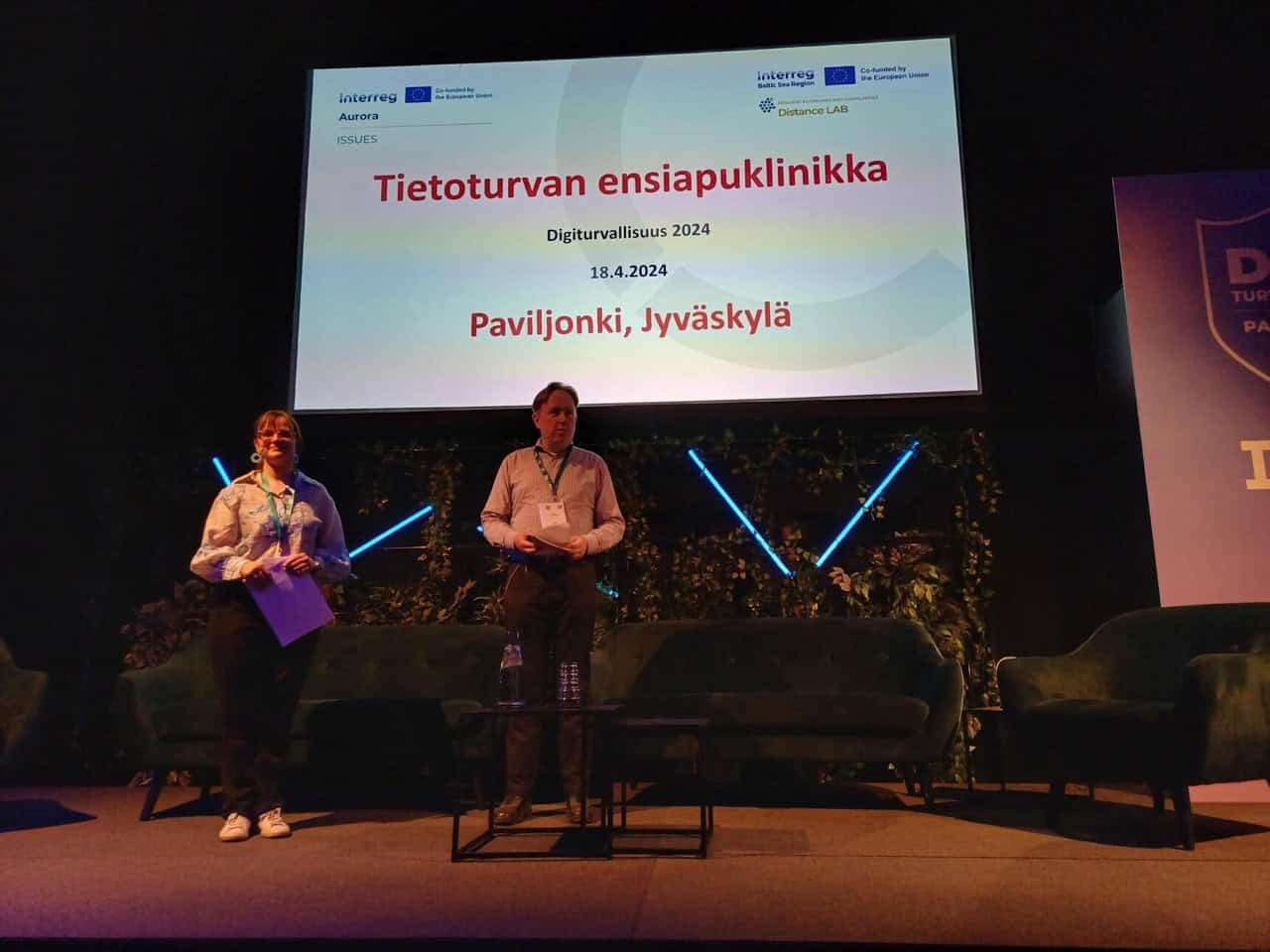 Laura Palovuori and Tom Tuunainen giving a presentation