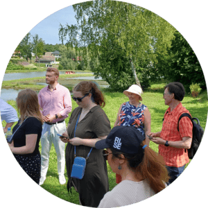 Participants of the meeting walking in the farm.