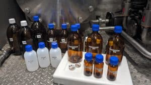 Line of bottles for testing different organic micropollutants in the EMPEREST pilot container