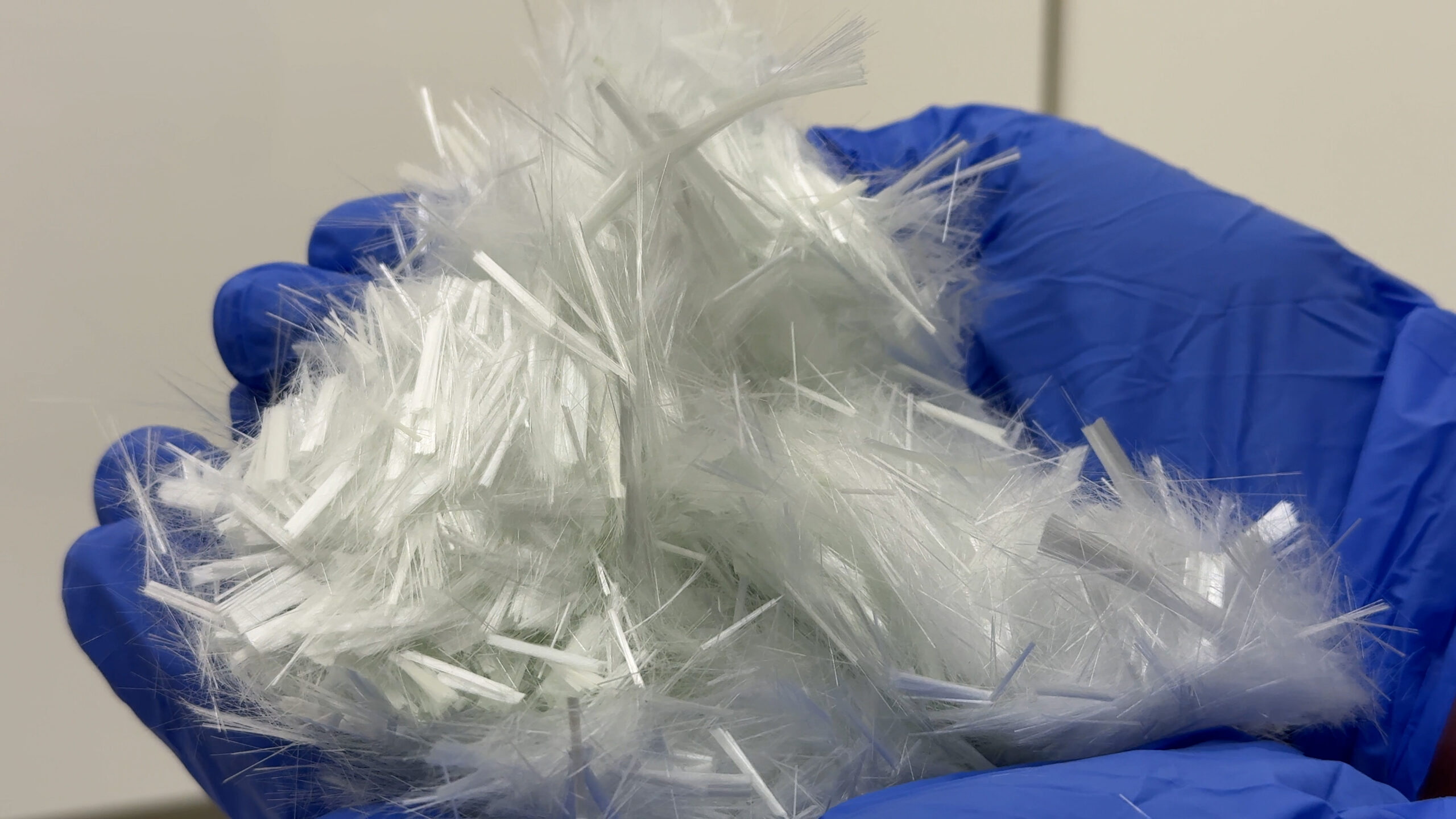 Glass fibers in pair of hands