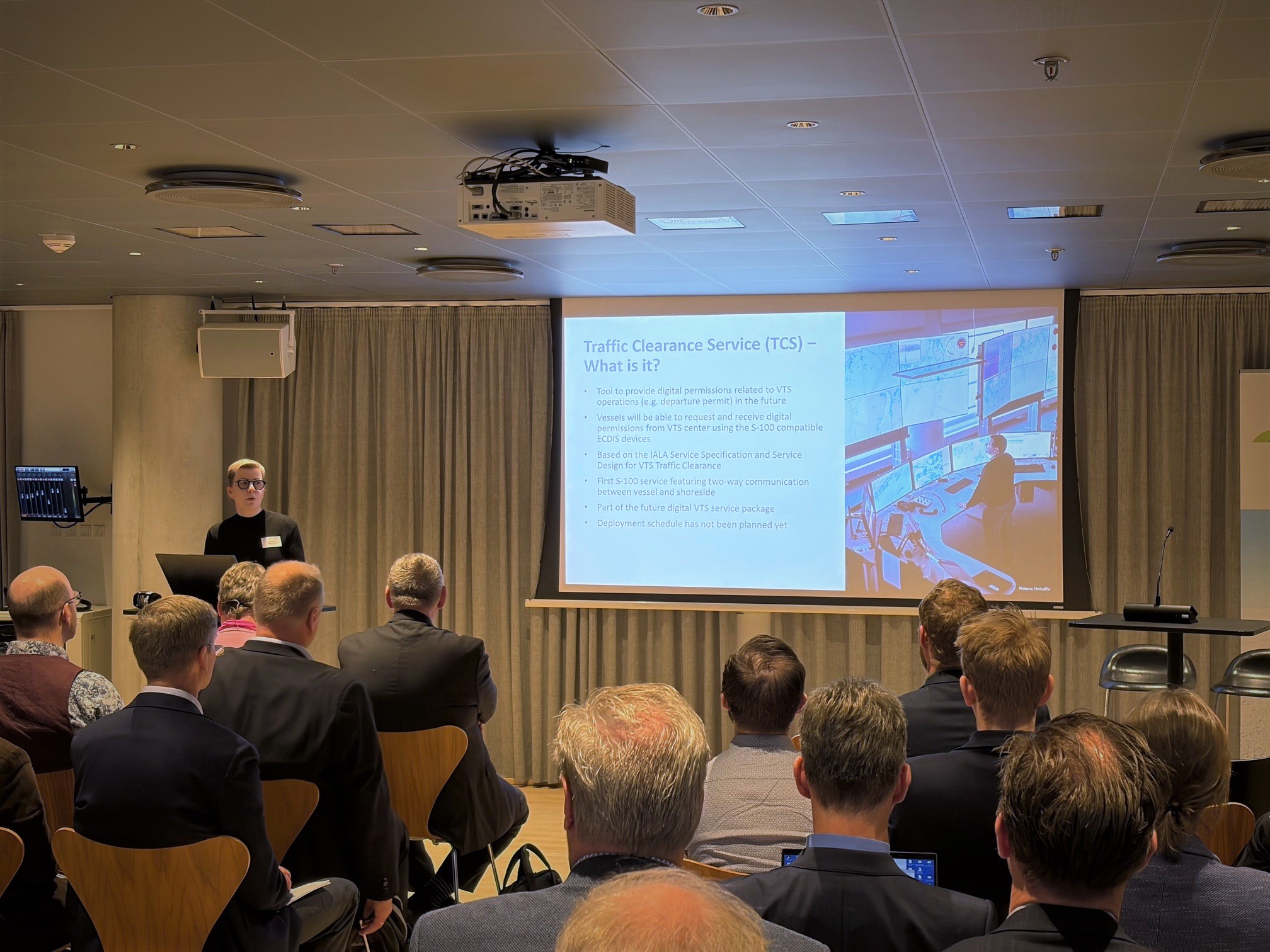 Sirpa Kannos giving a presentation to an audience.